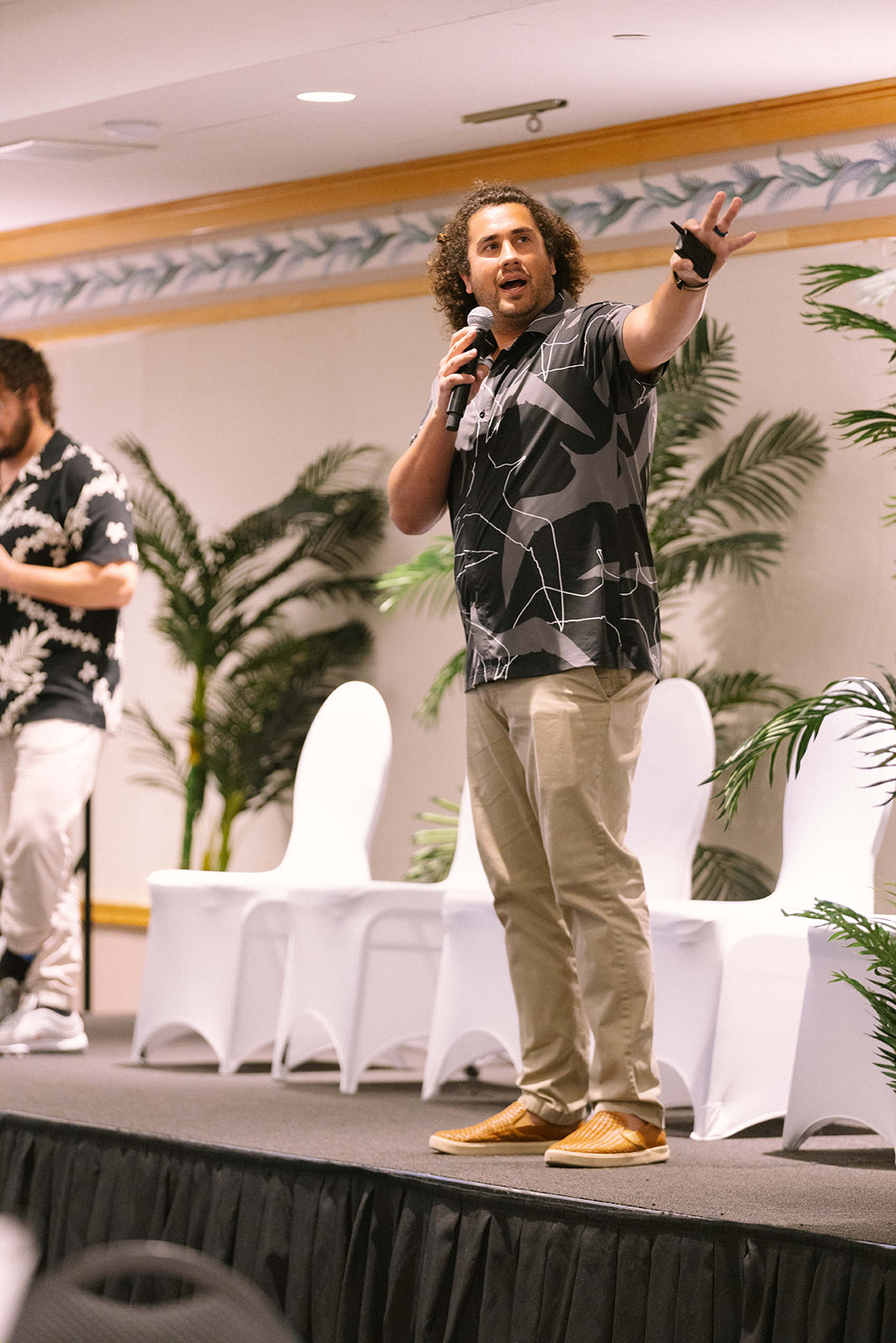 Josiah Hester speaking on stage at Eahou Fest in Honolulu, delivering the keynote 'AI is the Next Plantation: Unless We Rethink It.'